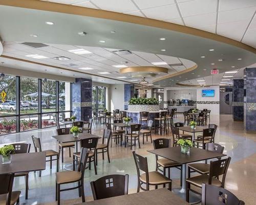 Interior rendering of Jupiter Medical Center dining room. Naturally lit room with table and chairs.